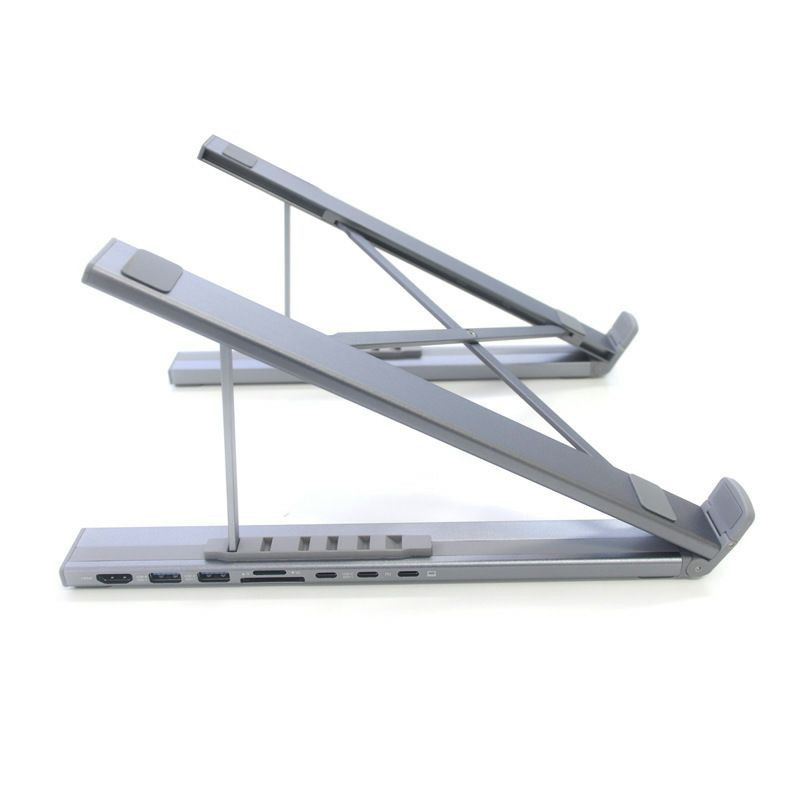 Station d'accueil avec support pour ordinateur portable pliable en aluminium, intégrant plusieurs ports de connectivité.